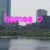 A static pixelated image shows a pink L-shaped object with rounded corners against a blurred background of gray and green tones.