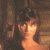 A pixelated image of a person with brown hair and light skin against a dark background, next to green text reading 'Original Icons .com' on a solid green field.