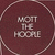 Maroon circular icon with light checkered border containing pixelated text reading "KOTT THE HOORE" in three lines.