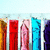 Six vertical pixelated bars in distinct colors against a light blue background, each with unique internal patterns and gradients.