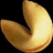 A golden fortune cookie with a visible crease, positioned next to pixelated text reading 'eat the cookie' and '=]' on a black background.