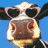 A pixelated cow face wearing heart-shaped sunglasses against a blue sky, with text reading "Lookin GOOO-OOOD!" on a dark red background.