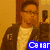 Pixelated image of a person in a brown jacket and white shirt with blue text overlay, next to a red triangular icon with white symbols on white background.