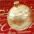 A pixelated spherical object with a rounded top sits against a red background with faint diagonal lines.