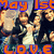 Pixelated image with orange text 'May 1st' at top and 'LOVE' at bottom, featuring multiple figures in dark clothing against a blurred background.