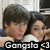 Two people with dark hair stand close together, one wearing a white shirt and the other in darker clothing, with text reading 'Gonglo' at the bottom.