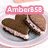 A pixelated image of two chocolate sandwich cookies on a plate with text overlays in various colors and styles.