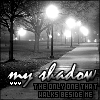 Black-and-white nighttime scene with a tree-lined path, streetlights, and foggy atmosphere, overlaid with text reading "my shadow" and "THE ONLY ONE THAT WALKS BESIDE ME".