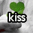 Green heart-shaped clover above text reading 'kiss' on top-left, 'me i'm' on top-right, and 'irish' on bottom-left over a blurred background.