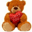 A static image of two teddy bears: one holding a red heart, the other pair embracing with one wearing a pink dress and the other a blue shirt.