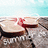 A pixelated image shows a red liquid splashing from a dark container against a light background with a blue sky and brown ground.