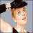 A pixelated image split into two sections: a person wearing a black hat on the left and pink background with text on the right.
