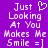 Purple background with white pixelated text reading 'Just Looking At You Makes Me Smile =]' and a heart symbol replacing the word 'heart' in the first line.