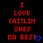 Red pixelated text on black background reads 'I LOVE CAITLIN SHES DA BEST' with blue heart symbol, repeated in three