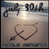 Beach scene with handwritten text 'july 30th' at top, heart-and-arrow symbol in sand below, and name 'nicole demarco' at bottom.