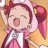 Pixelated anime character with pink hair and red headband, mouth open in a shout, wearing pink and white outfit with yellow accents, against light brown background.