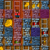 A static grid of pixelated icons with varied color schemes and shapes including yellow circles, blue rectangles, and red accents on purple and brown backgrounds.
