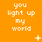 Pixelated orange background with repeated white text "you light up my world" and scattered white star-like symbols in a