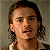 A split-frame contact sheet showing a pixelated character portrait on the left and green text logo on the right against gray background.