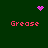 Green background with four pink 'Grease' texts and three pink pixelated icons: a heart, a starburst, and a circle.