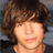 A pixelated image shows a person with brown hair on the left, and blue text 'Jonn' with a pink heart symbol on white background to the right.