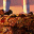 Pixelated character with brown hair and red shoulder accents, transitioning from full-body to head-only views against a pinkish background.