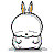 Pixelated cartoon character with closed eyes, rounded head, and two multicolored ears on top, rendered in grayscale with subtle color accents on ears.