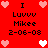 Red background with pixelated text and heart symbols arranged in a pattern, featuring repeated names and dates