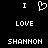 Black background with white pixelated text and symbols arranged in three : 'I', a heart symbol, 'I' on top ; 'LOVE' centered below; 'SHANNON' at bottom