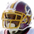 A pixelated image of a football player wearing a purple and gold helmet with visible face mask, set against red background sections containing text.