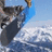Pixelated image of a person snowboarding on snowy terrain with blue sky background, next to vertical text "snow" and horizontal text "boarding" on solid blue