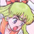 Pixelated cartoon character with light green hair, pink cheeks, and orange accents on a pale background.