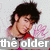 A four- shows a person with dark hair in a red shirt against a light background with pink handprints, with text overlays changing
