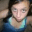 A pixelated image of a person in a blue and green top with hands behind head, overlaid with pink text reading 'SUMMER 07' on the right side.