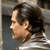 Static 50x50 pixel icon showing a side-profile of a person with dark hair and light skin wearing a white shirt against a blurred background.