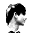 Pixelated grayscale profile of a person with dark hair and light skin, viewed from the side against a white background.
