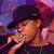 Pixelated animated contact sheet showing a person singing into a microphone with visible midriff and partial clothing in multiple frames.