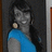 Pixelated static image of a person with dark hair wearing blue clothing against a dark background.