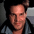 A 48x48 pixel animated contact sheet showing two frames of a buddy icon: left frame features a person with dark hair and light skin wearing a gray shirt, right frame displays the text "one tree hill" in white letters on an orange background.