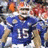 Pixelated image of a football player in blue uniform with number 15, surrounded by text elements on blue background.
