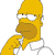 Pixelated yellow cartoon character with brown beard, white shirt, and gray pants, hand near chin in contemplative pose against white background