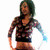 Pixelated image of a person with dark hair wearing a dark sleeveless top and dark shorts, standing with arms slightly outstretched against a white background.