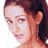 A 48x48 pixel animated contact sheet showing three sampled frames of a woman with long brown hair in different poses and lighting conditions, arranged in a 2x2 grid with one empty gray cell.
