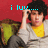 A person with dark curly hair sits on a green couch against a red background, wearing a yellow shirt and gray cardigan. The image displays pixelated text above the head in cyan.