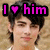 Pixelated image of a person with dark hair and light skin, overlaid with pink text reading "I ♡ him" on black rectangular backgrounds.