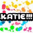 A pixelated image with colorful abstract shapes and a black banner displaying 'KATIE!!!' in white text.