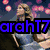 Pixelated image of a woman with blonde hair in two , one showing her holding a microphone and the other close-up, with overlaid text reading 'arahT7 Loves' and 'Taylor Swift'