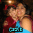 Pixelated image of a person in red and blue clothing with 'CUTIE' text overlay, dark background.