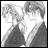 Two anime-style figures in grayscale, one with short hair and the other with longer hair, positioned side-by-side against a light background.