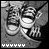 A black-and-white animated sequence showing a pair of sneakers with striped laces and white soles, positioned on a textured surface beneath a hand holding a fork.